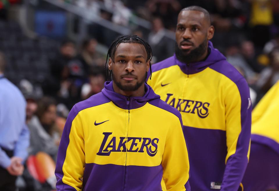 TORONTO, ON - NOVEMBER 1 - Los Angeles Lakers forward LeBron James (23) and Los Angeles Lakers guard Bronny James (9) warm up before the game as the Toronto Raptors fall to the Los Angeles Lakers at Scotiabank Arena in Toronto. November 1, 2024. (Photo by Steve Russell/Toronto Star via Getty Images)