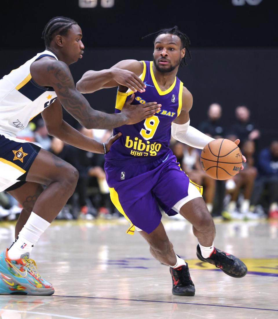 South Bay Lakers guard Bronny James drives to the basket against Salt Lake City.