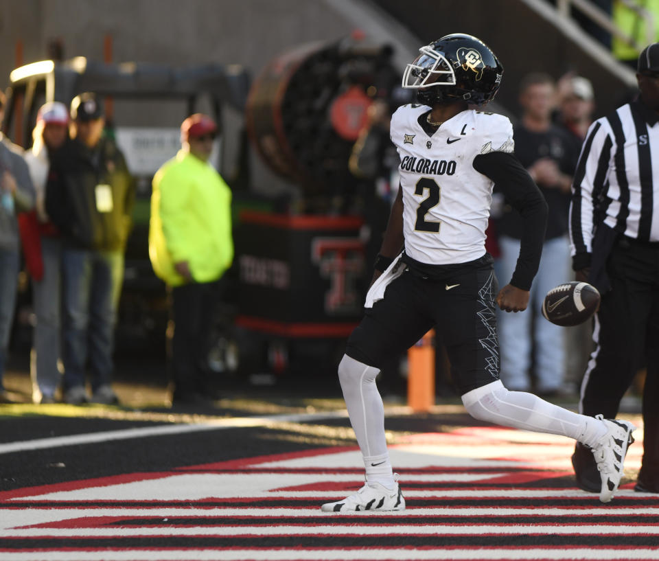 Colorado's quarterback Shedeur Sanders (2) celebrates his touchdown against Texas Tech during the second half of an NCAA college football game, Saturday, Nov. 9, 2024, in Lubbock, Texas. (AP Photo/Annie Rice)