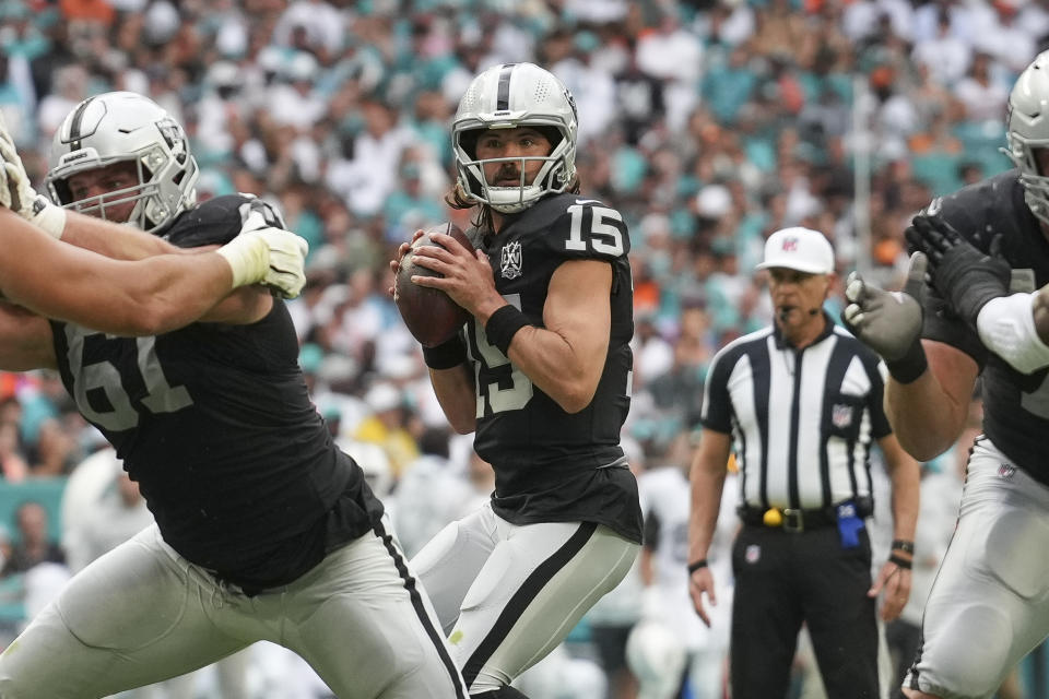 MIAMI GARDENS, FL - NOVEMBER 17: Las Vegas Raiders quarterback Gardner Minshew (15) looks for an open receiver from the pocket during the game between the Las Vegas Raiders and the Miami Dolphins on Sunday, November 17, 2024 at Hard Rock Stadium in Miami Gardens, Fla. (Photo by Peter Joneleit/Icon Sportswire via Getty Images)