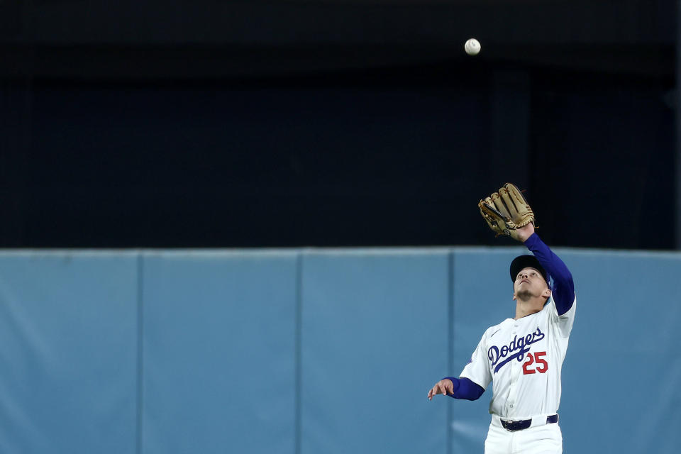 LOS ANGELES, CALIFORNIA - SEPTEMBER 24: Tommy Edman #25 of the Los Angeles Dodgers makes a catch in the outfield during the first inning against the San Diego Padres at Dodger Stadium on September 24, 2024 in Los Angeles, California. (Photo by Katelyn Mulcahy/Getty Images)