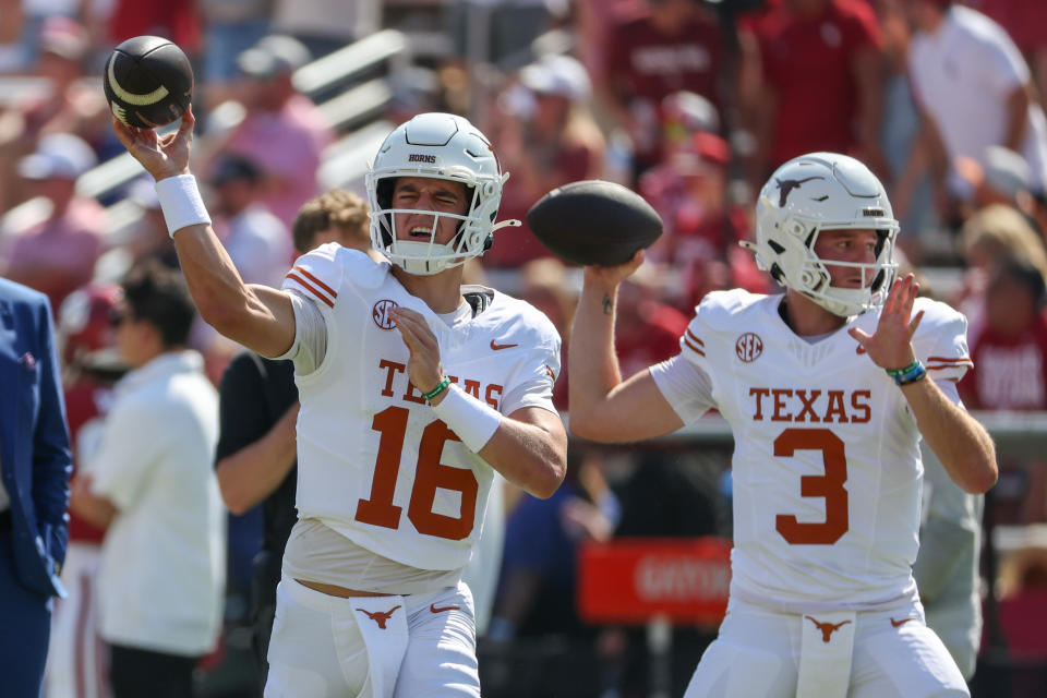 DALLAS, TX - OCTOBER 12: Texas Longhorns quarterback Arch Manning (16) and Texas Longhorns quarterback Quinn Ewers (3) run a passing drill before the Allstate Red River Rivalry SEC college football game between Texas Longhorns and Oklahoma Sooners on October 12, 2024, at Cotton Bowl Stadium in Dallas, TX. (Photo by David Buono/Icon Sportswire via Getty Images)