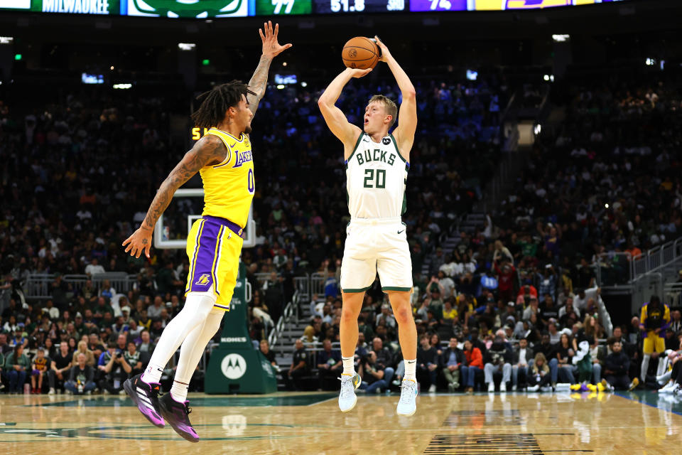 MILWAUKEE, WISCONSIN - OCTOBER 10: AJ Green #20 of the Milwaukee Bucks shoots over Jalen Hood-Schifino #0 of the Los Angeles Lakers at Fiserv Forum on October 10, 2024 in Milwaukee, Wisconsin. NOTE TO USER: User expressly acknowledges and agrees that, by downloading and or using this photograph, User is consenting to the terms and conditions of the Getty Images License Agreement. (Photo by Stacy Revere/Getty Images)