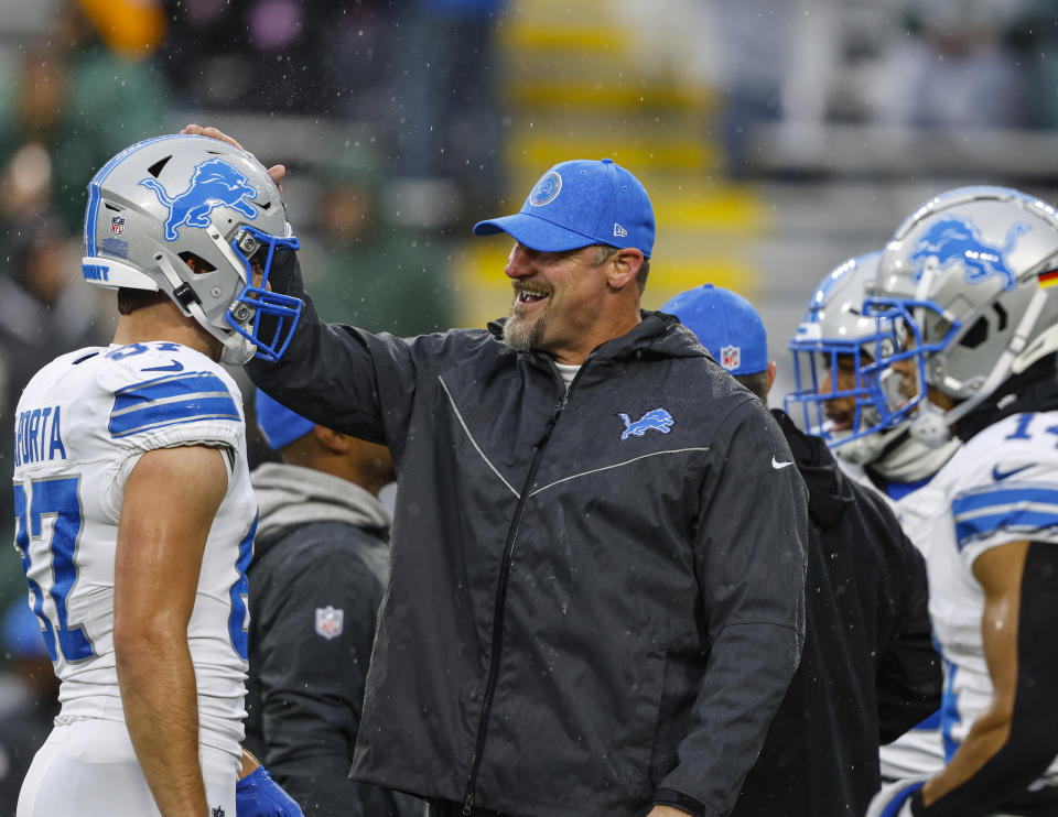 Detroit Lions Head coach Dan Campbell greets Sam Laporta before a NFL football game against the Green Bay Packers Sunday, Nov. 3, 2024, in Green Bay, Wis. (AP Photo/Jeffrey Phelps