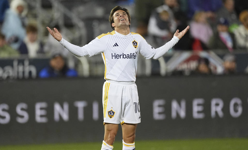 Los Angeles Galaxy midfielder Riqui Puig (10) reacts after scoring a goal in the second half of the second match of an MLS Cup opening-round playoff series Friday, Nov. 1, 2024, in Commerce City, Colo. (AP Photo/David Zalubowski)