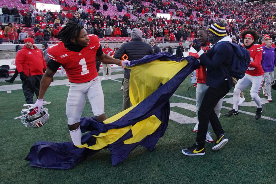 COLUMBUS, OHIO - NOVEMBER 30: Davison Igbinosun #1 of the Ohio State Buckeyes grabs a Michigan flag following his team's defeat against the Michigan Wolverines at Ohio Stadium on November 30, 2024 in Columbus, Ohio. (Photo by Jason Mowry/Getty Images)