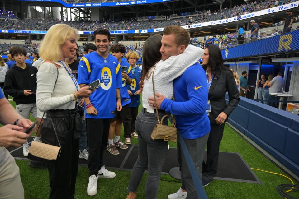 Rams coach Sean McVay gets a hug from his then fiancee Veronika Khomyn in 2022 as his mother Cindy McVay, left, watches.