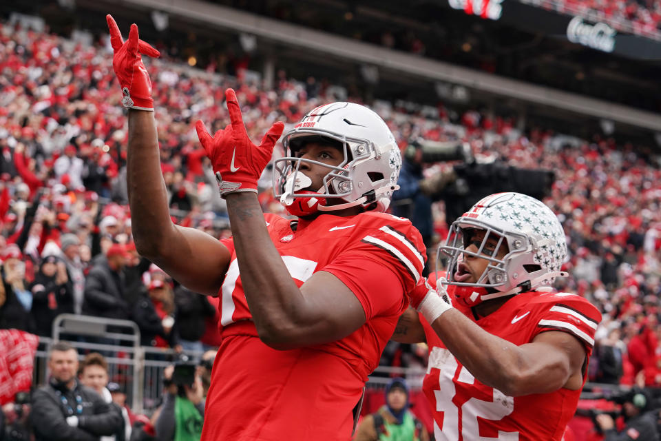 COLUMBUS, OHIO - NOVEMBER 23: Jelani Thurman #15 and TreVeyon Henderson #32 of the Ohio State Buckeyes celebrate after Thurman scored a touchdown in the third quarter against the Indiana Hoosiers at Ohio Stadium on November 23, 2024 in Columbus, Ohio. (Photo by Jason Mowry/Getty Images)