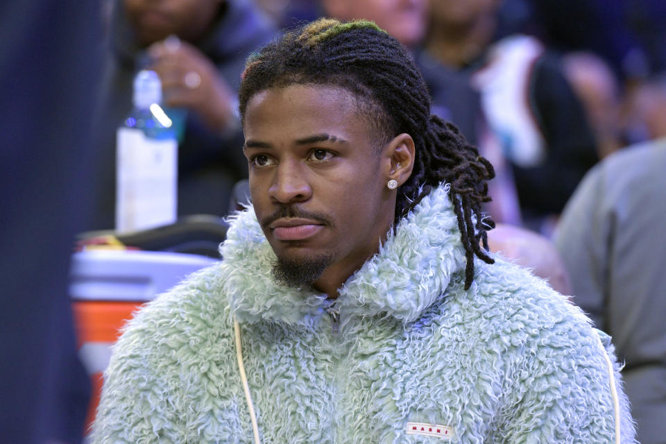 Memphis Grizzlies guard Ja Morant looks on from the bench in the first half of an NBA basketball game against the Washington Wizards Friday, Nov. 8, 2024, in Memphis, Tenn. (AP Photo/Brandon Dill)