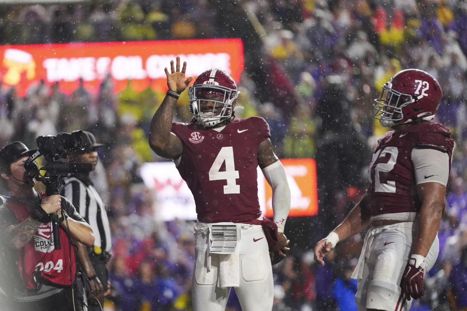 Alabama quarterback Jalen Milroe (4) celebrates his touchdown carry in the first half an NCAA college football game against LSU in Baton Rouge, La., Saturday, Nov. 9, 2024. (AP Photo/Gerald Herbert)