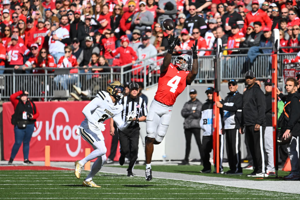 COLUMBUS, OHIO - NOVEMBER 09: Jeremiah Smith #4 of the Ohio State Buckeyes makes a catch during the first quarter of a game against the Purdue Boilermakers at Ohio Stadium on November 09, 2024 in Columbus, Ohio. (Photo by Ben Jackson/Getty Images)