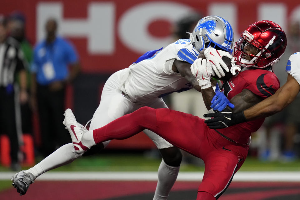 Houston Texans wide receiver John Metchie III catches a 15-yard touchdown pass in front of Detroit Lions cornerback Terrion Arnold. (AP Photo/David J. Phillip)