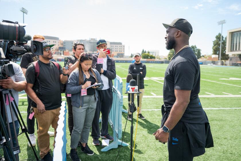 LOS ANGELES, CA - March 15, 2024: UCLA head coach Deshaun Foster talks with the media after UCLA football's annual Pro Day. (Michael Owen Baker / For The Times)