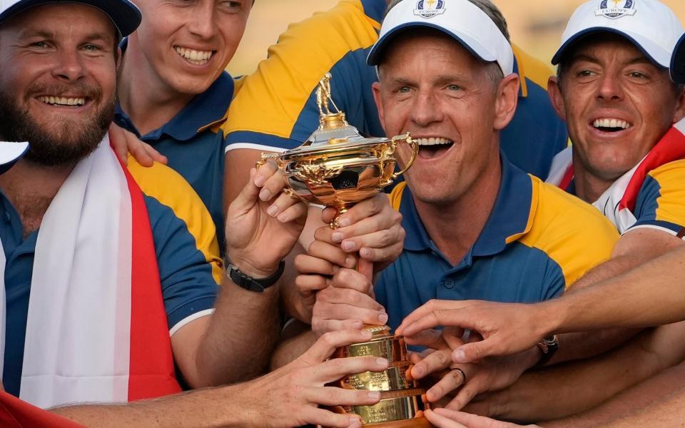 Europe's Team Captain Luke Donald, centre, and team members lift the Ryder Cup after winning the trophy by defeating the United States 16/12 point to 11 1/2 points at the Marco Simone Golf Club in Guidonia Montecelio, Italy, on October 1, 2023.