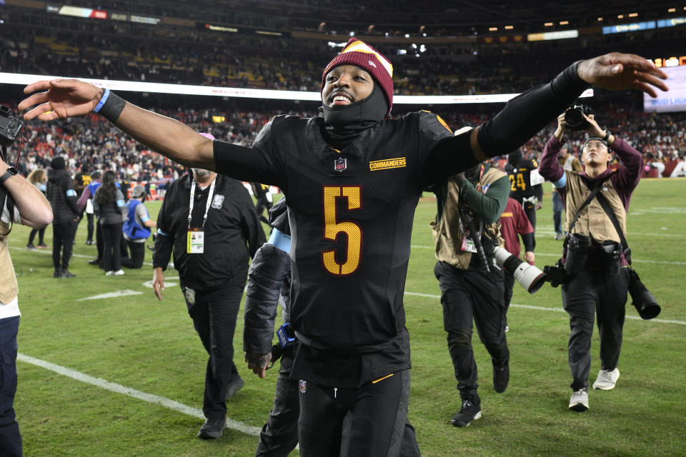 Washington Commanders quarterback Jayden Daniels (5) celebrates after a memorable win over the Bears. (AP Photo/Nick Wass)