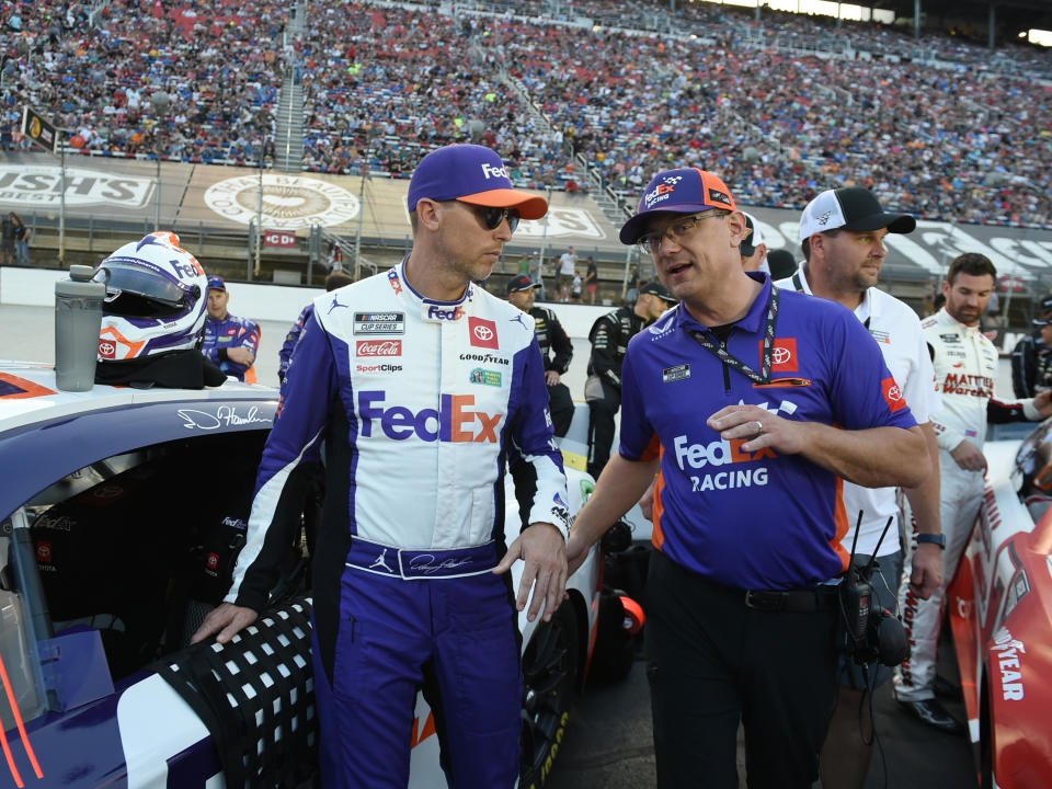 BRISTOL, TN - SEPTEMBER 21: Denny Hamlin (#11 Joe Gibbs Racing FedEx Toyota) and his crew chief Chris Gabehart talk prior to the running of the NASCAR Cup Series Bass Pro Shops Night Race on September 21, 2024, at Bristol Motor Speedway in Bristol, TN. (Photo by Jeffrey Vest/Icon Sportswire via Getty Images)