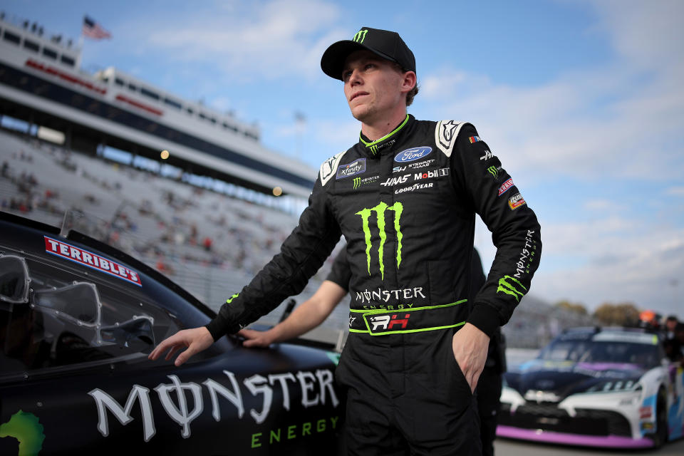 MARTINSVILLE, VIRGINIA - NOVEMBER 01: Riley Herbst, driver of the #98 Monster Energy Ford, walks the grid during qualifying for the NASCAR Xfinity Series National Debt Relief 250 at Martinsville Speedway on November 01, 2024 in Martinsville, Virginia. (Photo by Jonathan Bachman/Getty Images)