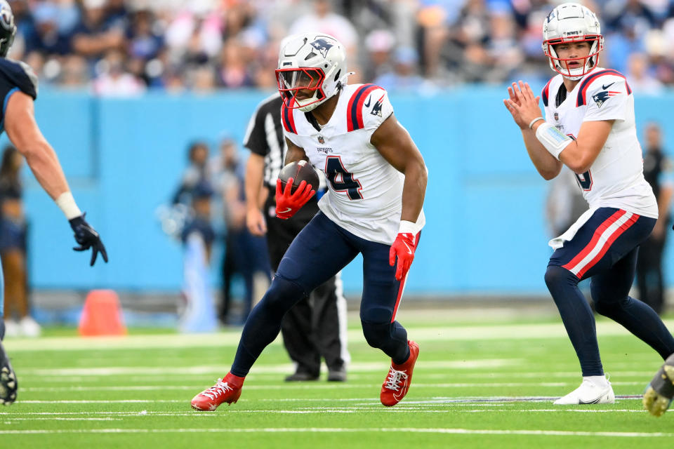 Nov 3, 2024; Nashville, Tennessee, USA; New England Patriots running back Antonio Gibson (4) runs the ball against the Tennessee Titans during the second half at Nissan Stadium. Mandatory Credit: Steve Roberts-Imagn Images