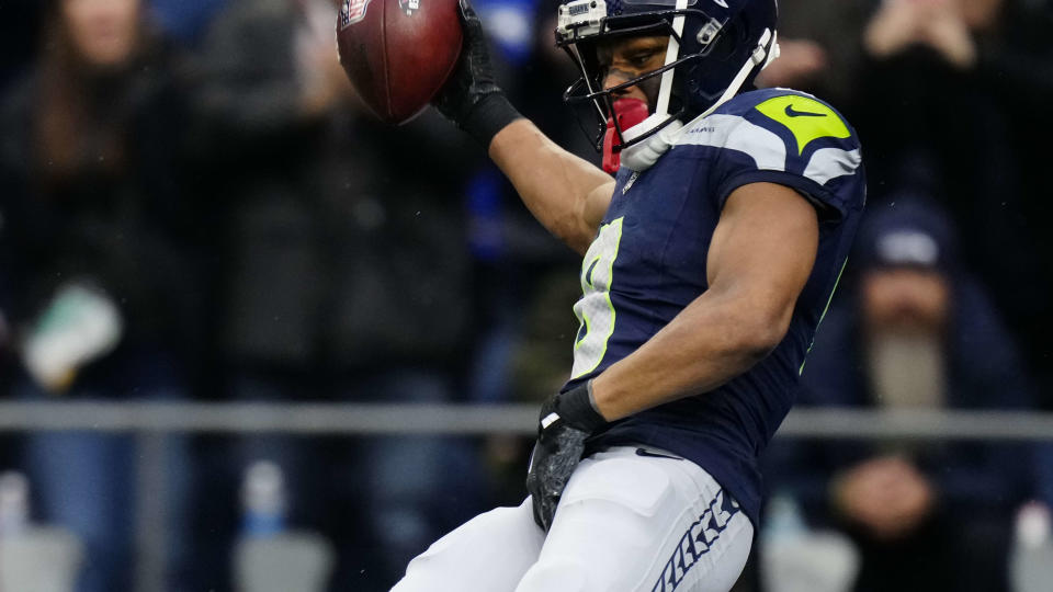 Seattle Seahawks cornerback Coby Bryant (8) intercepts the ball and runs for a touchdown during an NFL football game against the Arizona Cardinals, Sunday, Nov. 24, 2024 in Seattle. The Seahawks defeated the Cardinals 16-6. (AP Photo/Ben VanHouten)