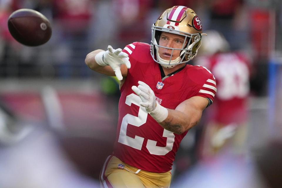 San Francisco 49ers running back Christian McCaffrey catches passes before a game against the Arizona Cardinals.