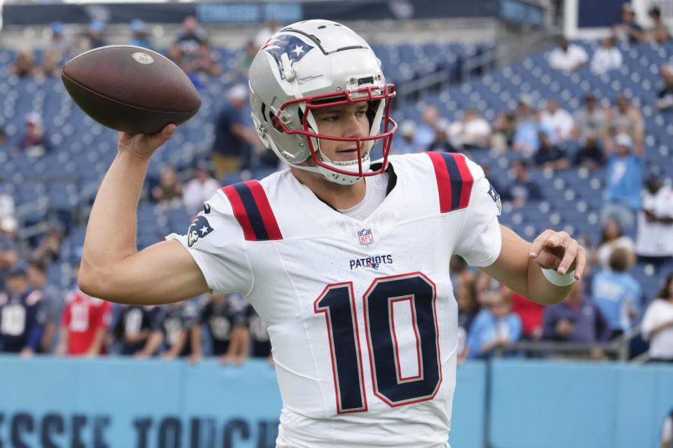 New England Patriots quarterback Drake Maye (10) warms up before a game.