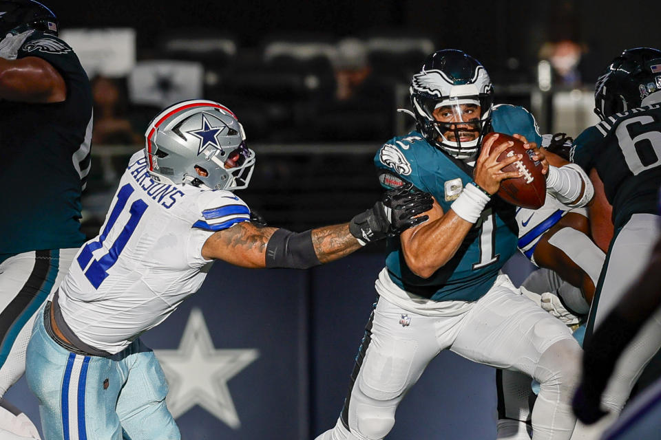 ARLINGTON, TX - NOVEMBER 10: Philadelphia Eagles quarterback Jalen Hurts (1) tries to avoid Dallas Cowboys linebacker Micah Parsons (11) during the game between the Dallas Cowboys and the Philadelphia Eagles on November 10, 2024 at AT&T Stadium in Arlington, Texas. (Photo by Matthew Pearce/Icon Sportswire via Getty Images)