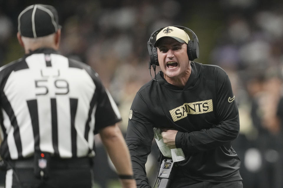 New Orleans Saints interim head coach Darren Rizzi, right, shouts at an official in the first half of an NFL football game in New Orleans, Sunday, Nov. 17, 2024. (AP Photo/Gerald Herbert)