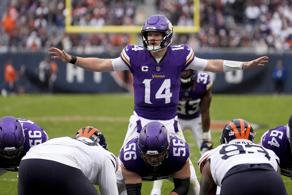 Minnesota Vikings quarterback Sam Darnold (14) calls a play during the second half of an NFL football game against the Chicago Bears, Sunday, Nov. 24, 2024, in Chicago. (AP Photo/Charles Rex Arbogast)