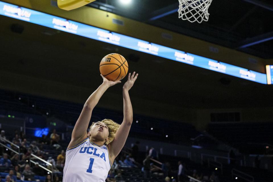 UCLA guard Kiki Rice goes up for a layup during the Bruins' win over Arkansas on Nov. 17.