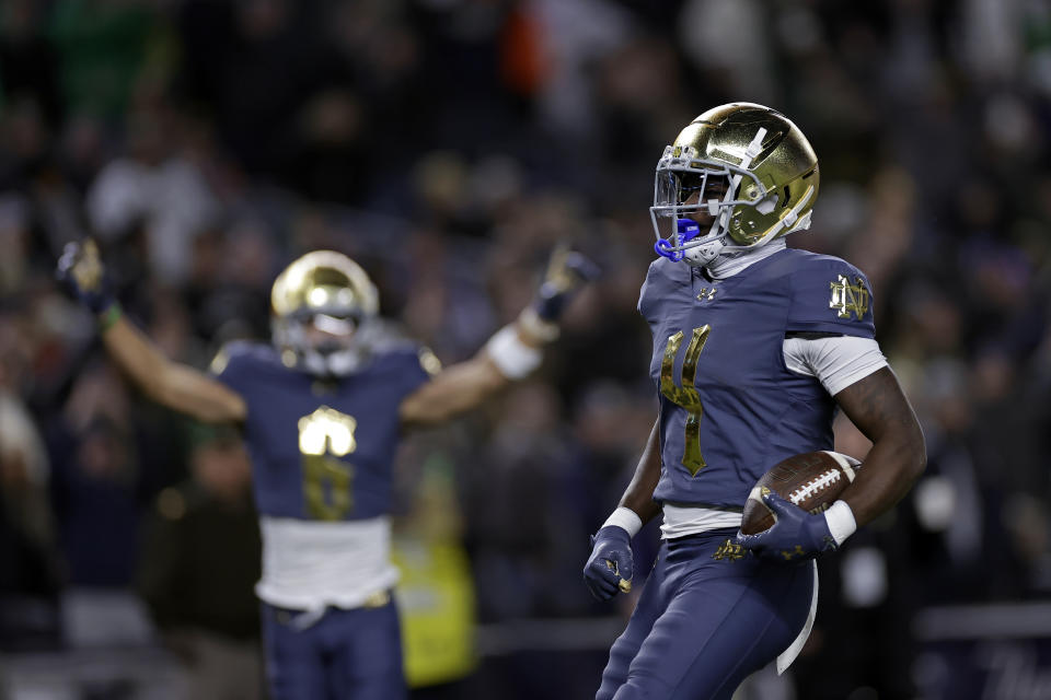 Notre Dame running back Jeremiyah Love scores a touchdown during the first half of an NCAA college football game against Army at Yankee Stadium on Saturday, Nov. 23, 2024, in New York. (AP Photo/Adam Hunger)