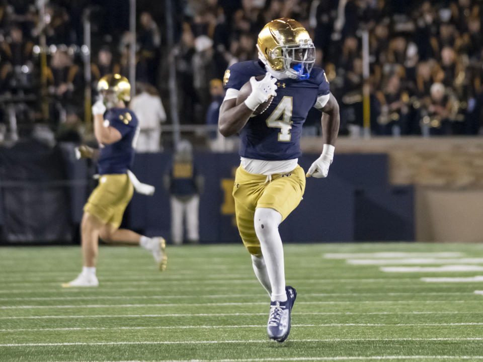 SOUTH BEND, IN - NOVEMBER 16: Notre Dame Fighting Irish running back Jeremiyah Love (4) runs the ball for a touchdown during the game between the Notre Dame Fighting Irish and the Virginia Cavaliers at Notre Dame Stadium in South Bend, IN on November 16, 2024. (Photo by Joseph Weiser/Icon Sportswire via Getty Images)