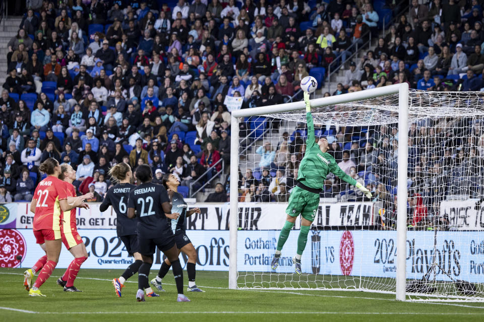 HARRISON, NEW JERSEY - NOVEMBER 10: Ann-Katrin Berger #30 of NJ/NY Gotham FC jumps and stops the shot on goal in the first half of the 2024 National Women's Soccer League Playoff match against Portland Thorns FC at Red Bull Arena on November 10, 2024 in Harrison, New Jersey. (Photo by Ira L. Black - Corbis/Getty Images)