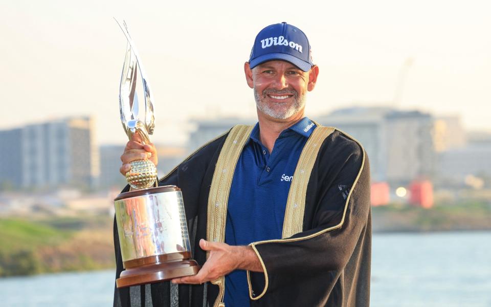 Paul Waring holds the Abu Dhabi HSBC Championship trophy