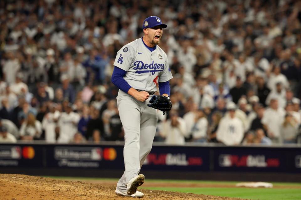 Dodgers pitcher Blake Treinen reacts recording the last out in the eighth inning of Game 5 of the World Series