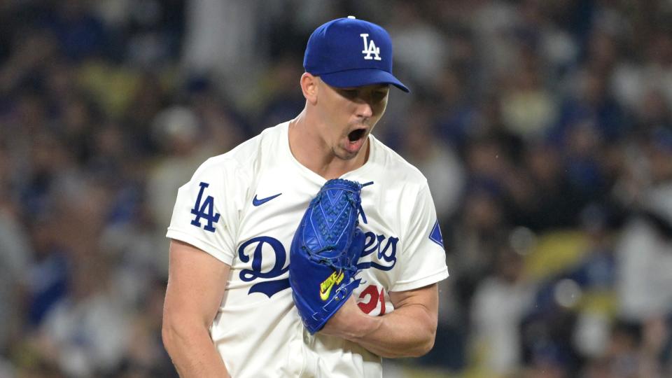  Los Angeles Dodgers starting pitcher Walker Buehler (21) reacts after a double play to end the fourth inning against the San Diego Padres at Dodger Stadium. 