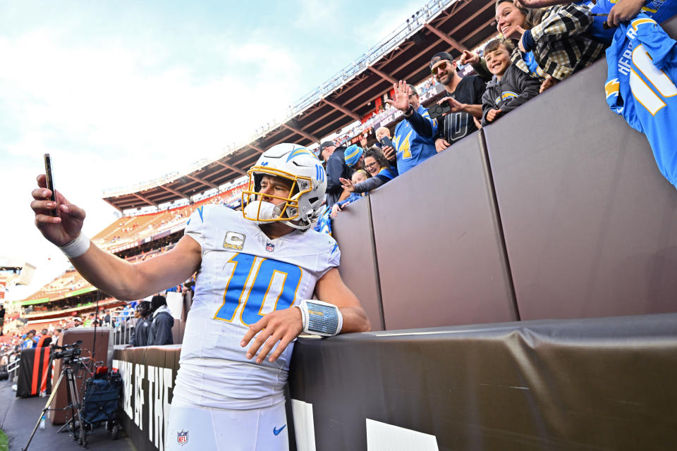 Join Yahoo Sports NFL experts Nate Tice and Charles McDonald on the Discussions feature in the Yahoo Sports app as Justin Herbert and the Chargers take on the Ravens. (Photo by Jason Miller/Getty Images)