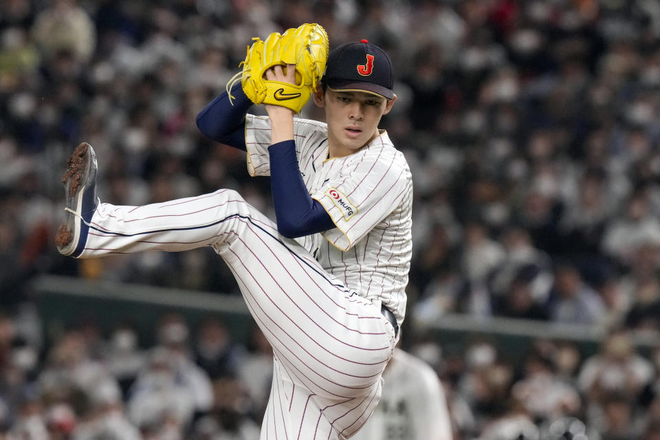 FILE - Roki Sasaki, of Japan pitches, during their Pool B game against the Czech Republic at the World Baseball Classic at the Tokyo Dome, Japan, Saturday, March 11, 2023. (AP Photo/Eugene Hoshiko, File)