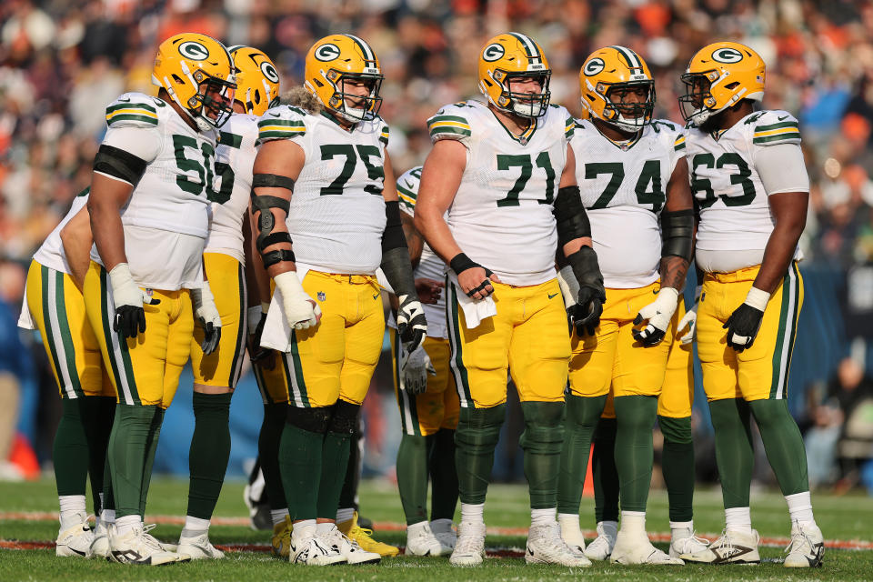 CHICAGO, ILLINOIS - NOVEMBER 17: Zach Tom #50, Sean Rhyan #75, Josh Myers #71, Elgton Jenkins #74 and Rasheed Walker #63 of the Green Bay Packers look on against the Chicago Bears at Soldier Field on November 17, 2024 in Chicago, Illinois. (Photo by Michael Reaves/Getty Images)