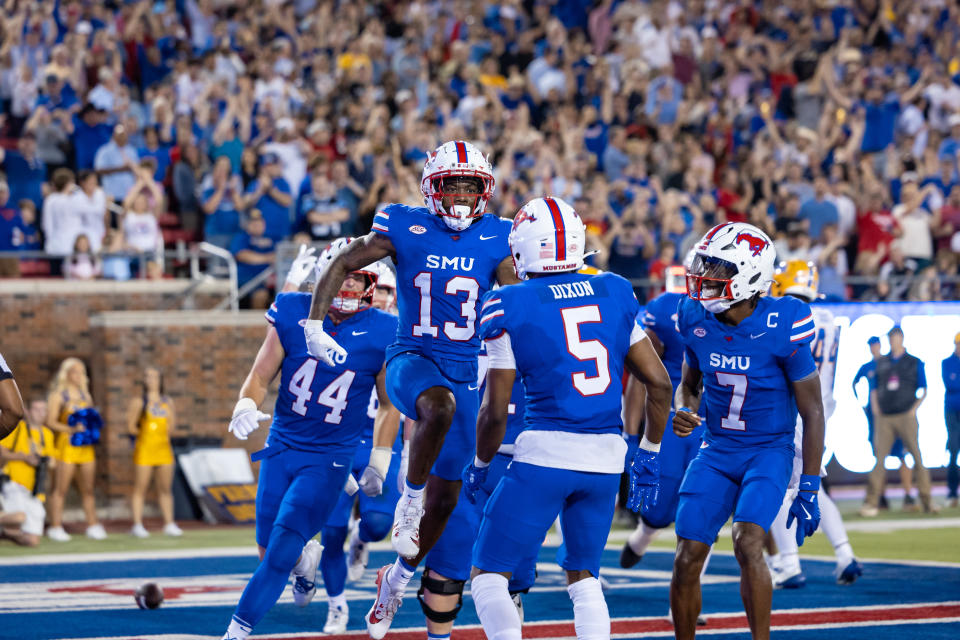 DALLAS, TX - NOVEMBER 02: SMU Mustangs wide receiver Roderick Daniels Jr. (#13) celebrates with teammates after scoring a touchdown during the college football game between the SMU Mustangs and the Pittsburgh Panthers on November 2, 2024, at Gerald J. Ford Stadium in Dallas, TX. (Photo by Matthew Visinsky/Icon Sportswire via Getty Images)