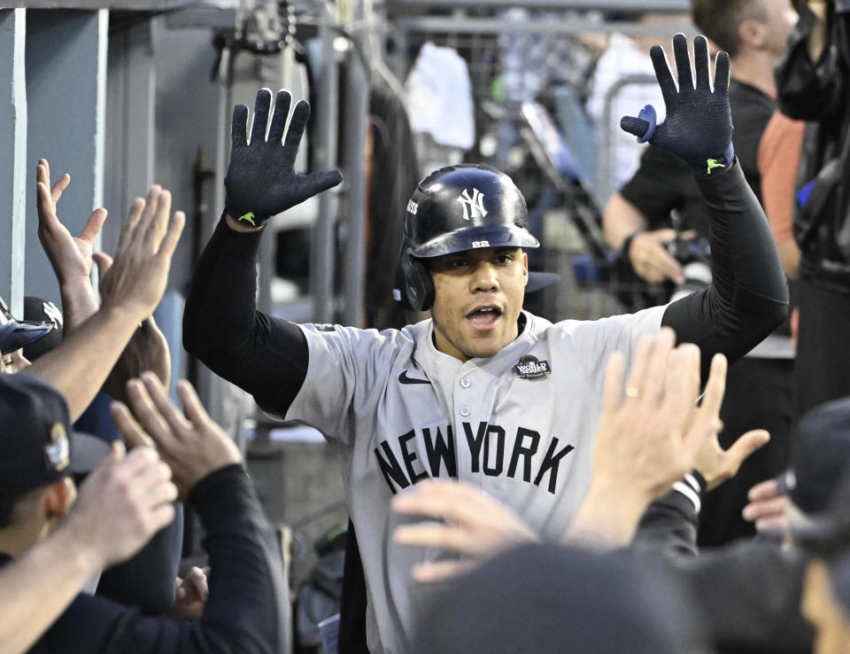 Los Angeles, CA - October 26: Juan Soto of the New York Yankees high fives teammates after hitting a solo home run against the Los Angeles Dodgers in the third inning during Game 2 of a World Series baseball game at Dodger Stadium in Los Angeles on Saturday, October 26, 2024. (Photo by Keith Birmingham/MediaNews Group/Pasadena Star-News via Getty Images)