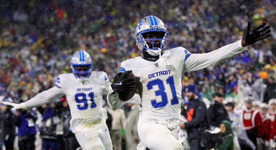 Nov 3, 2024; Green Bay, Wisconsin, USA; Detroit Lions safety Kerby Joseph (31) returns an interception for a touchdown near the end of the first half against the Green Bay Packers at Lambeau Field. Mandatory Credit: Tork Mason-Imagn Images TPX IMAGES OF THE DAY