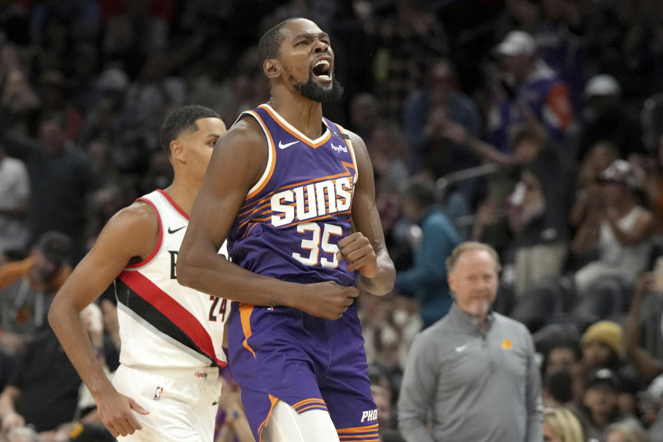 Phoenix Suns forward Kevin Durant (35) reacts after scoring against the Portland Trail Blazers during the first half of an NBA basketball game, Saturday, Nov. 2, 2024, in Phoenix. (AP Photo/Rick Scuteri)