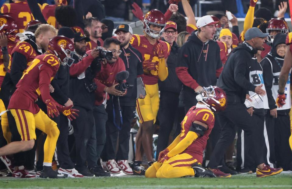 USC safety Akili Arnold celebrates after UCLA turns over the ball late in the fourth quarter Saturday.