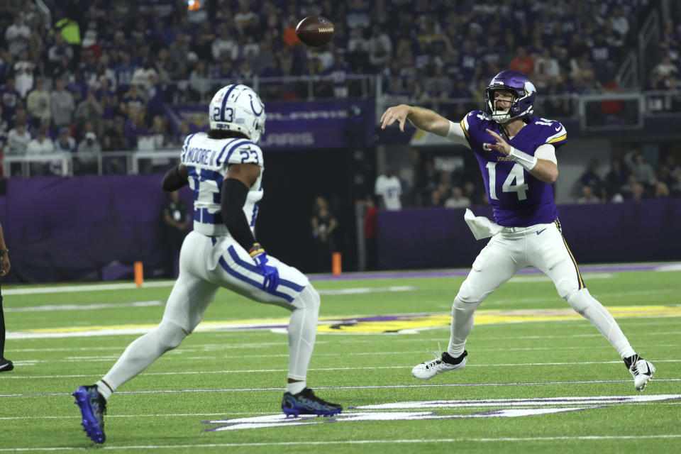 Minnesota Vikings quarterback Sam Darnold (14) throws a pass over Indianapolis Colts cornerback Samuel Womack III (33) during the first half of an NFL football game, Sunday, Nov. 3, 2024, in Minneapolis. (AP Photo/Ellen Schmidt)