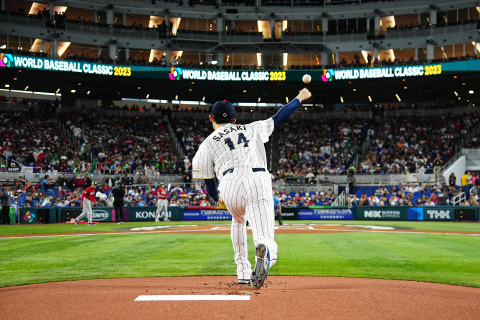 MIAMI, FL - MARCH 20: Roki Sasaki #14 of Team Japan wars up before the 2023 World Baseball Classic Semifinal game between Team Mexico and Team Japan at loanDepot Park on Monday, March 20, 2023 in Miami, Florida. (Photo by Mary DeCicco/WBCI/MLB Photos via Getty Images)