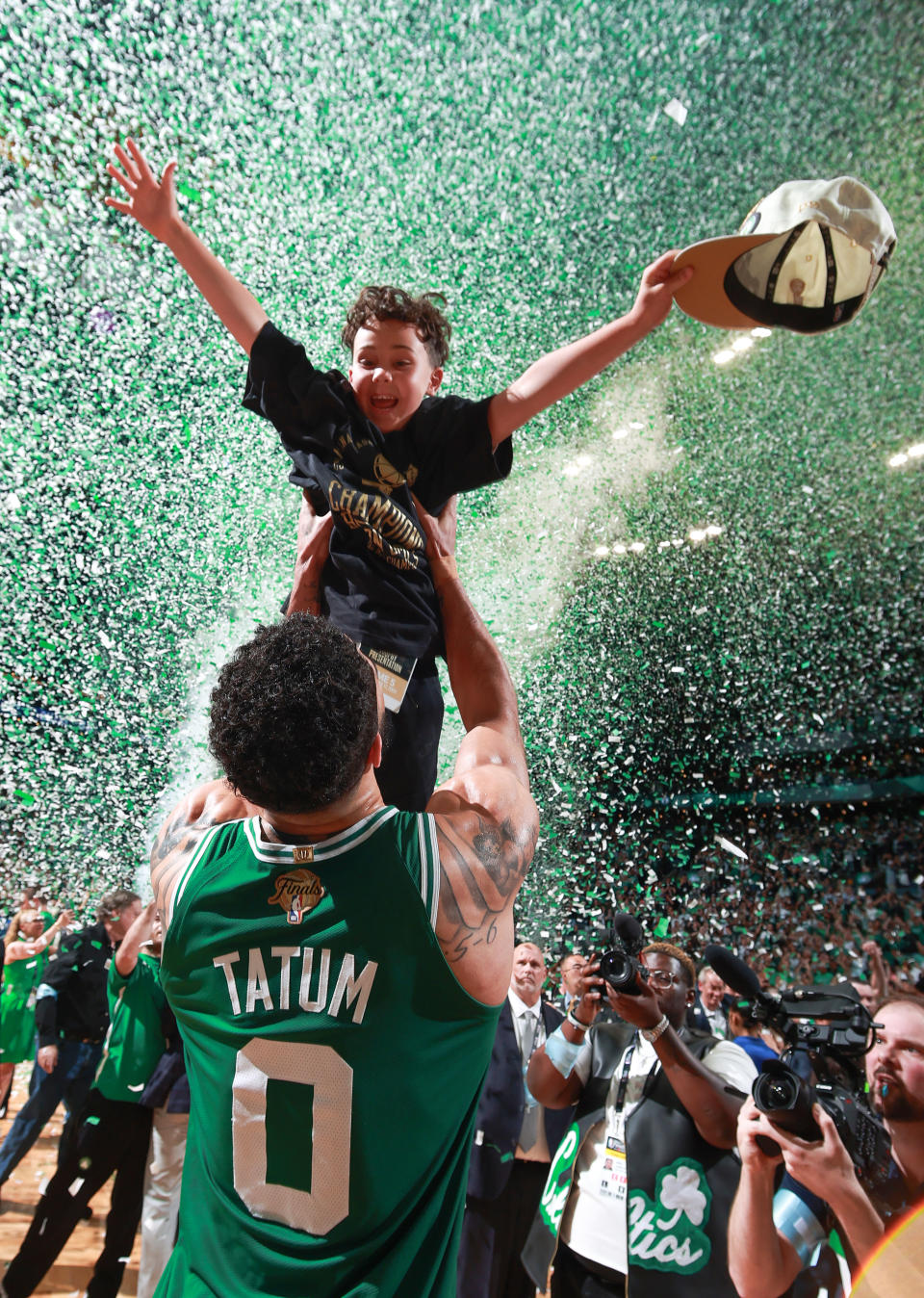 BOSTON, MA - JUNE 17: Jayson Tatum #0 of the Boston Celtics celebrates with Deuce Tatum after winning the 2024 NBA Championship against the Dallas Mavericks during Game 5 of the 2024 NBA Finals on June 17, 2024 at the TD Garden in Boston, Massachusetts. (Photo by Nathaniel S. Butler/NBAE via Getty Images)