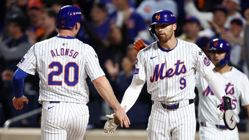 Oct 8, 2024; New York City, New York, USA; New York Mets first baseman Pete Alonso (20) celebrates scoring with outfielder Brandon Nimmo (9) on a two run single by outfielder Starling Marte (not pictured) in the sixth inning against the Philadelphia Phillies during game three of the NLDS for the 2024 MLB Playoffs at Citi Field. 