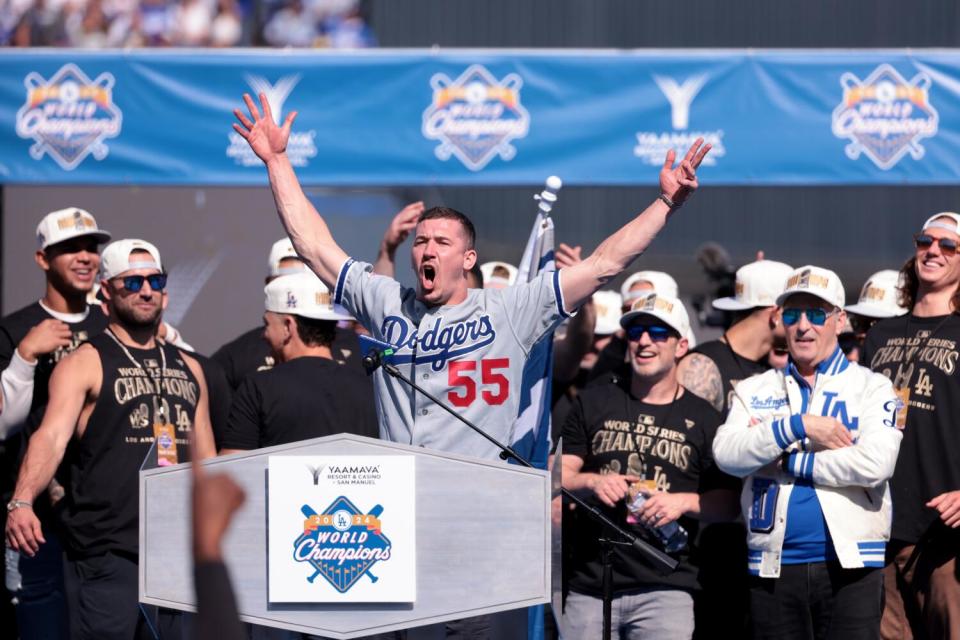 Walker Buehler, wearing an Orel Hershiser jersey, speaking at a lectern