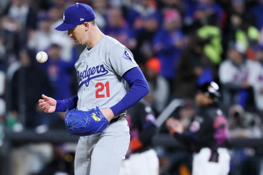 NEW YORK, NEW YORK - OCTOBER 16: Walker Buehler #21 of the Los Angeles Dodgers tosses a ball.