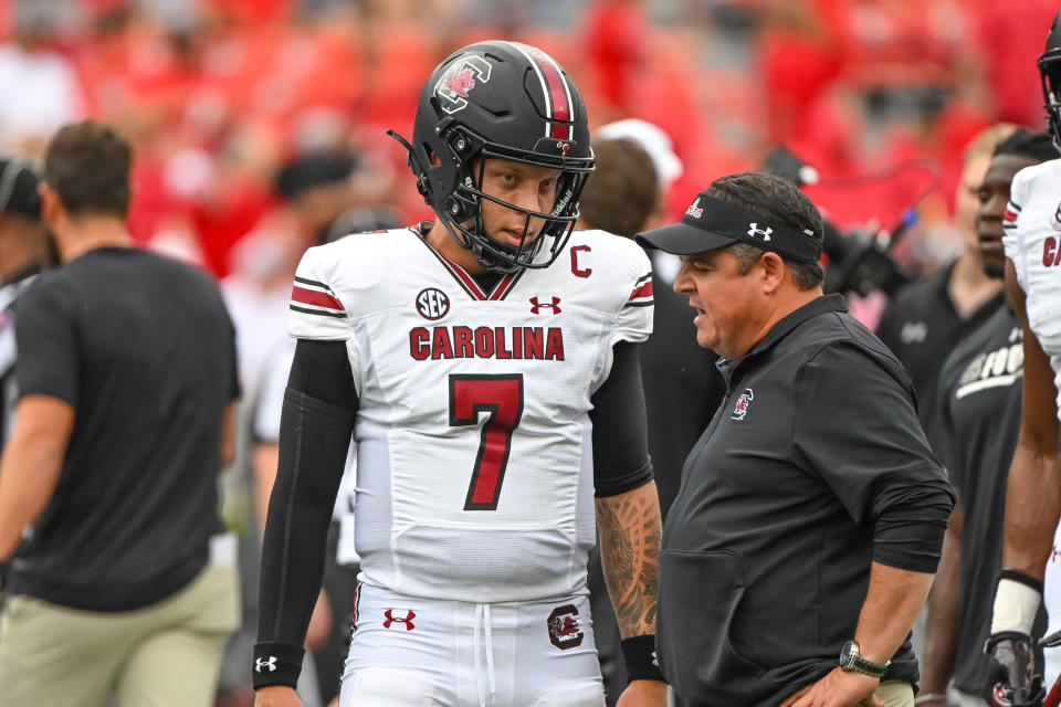 ATHENS, GA - SEPTEMBER 16: South Carolina Gamecocks defensive end Jordan Strachan (7) with South Carolina Gamecocks offensive coordinator Dowell Loggains prior to the college football game between the South Carolina Gamecocks and Georgia Bulldogs on September 16, 2023, at Sanford Stadium in Athens, GA. (Photo by John Adams/Icon Sportswire via Getty Images)